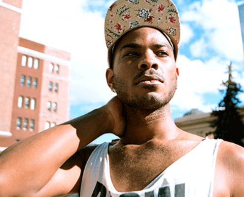 Young african american man in tank top outside